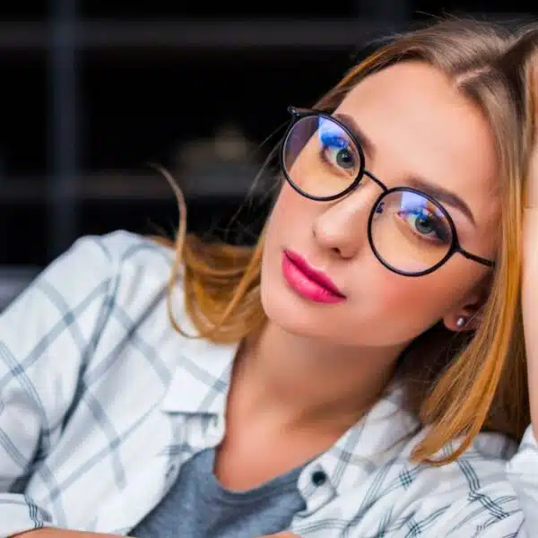 woman laptop glasses bored