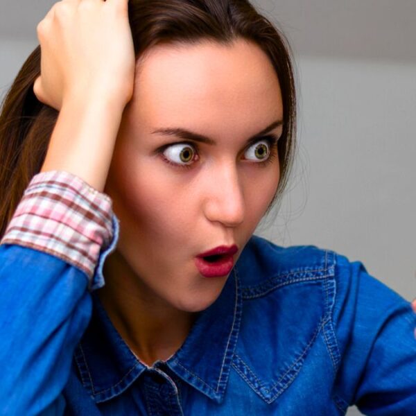 woman phone shock reading