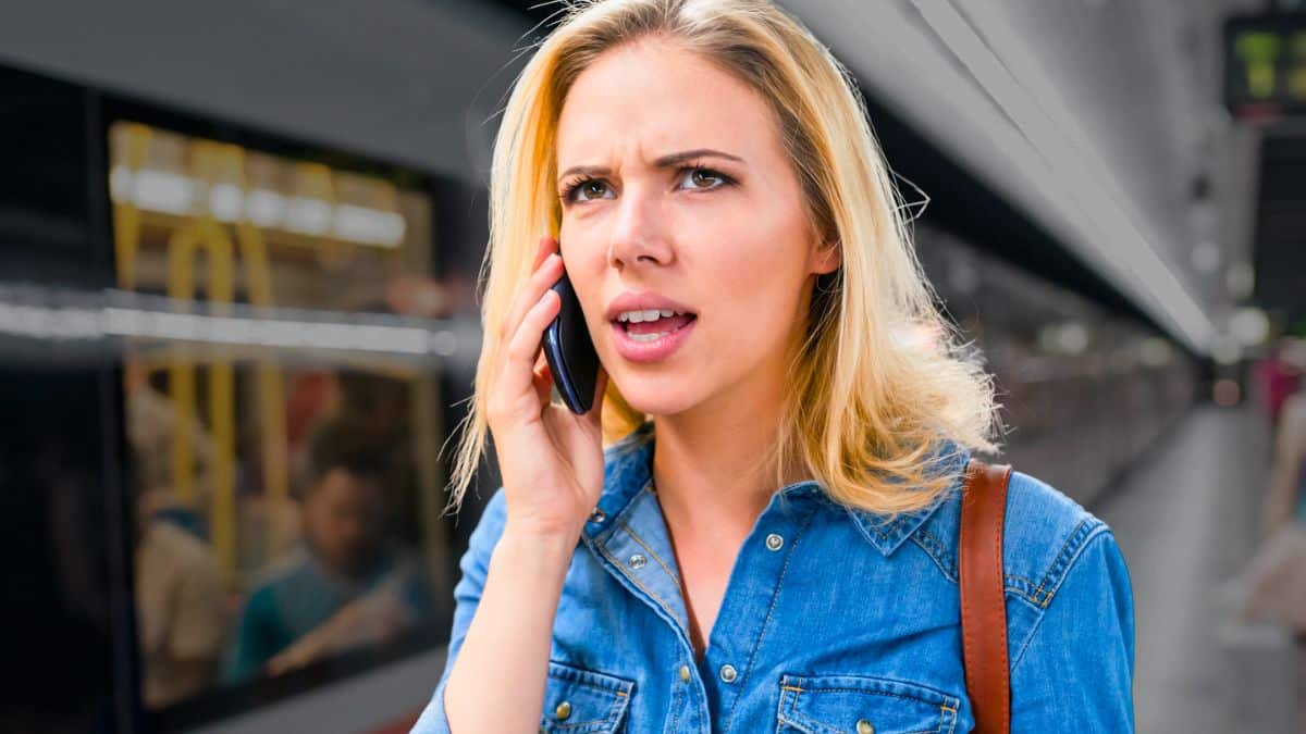 woman phone train talking
