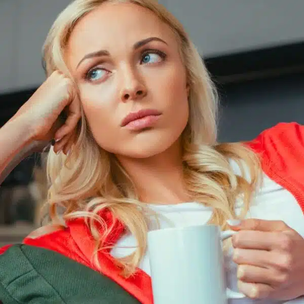 woman sad with coffee