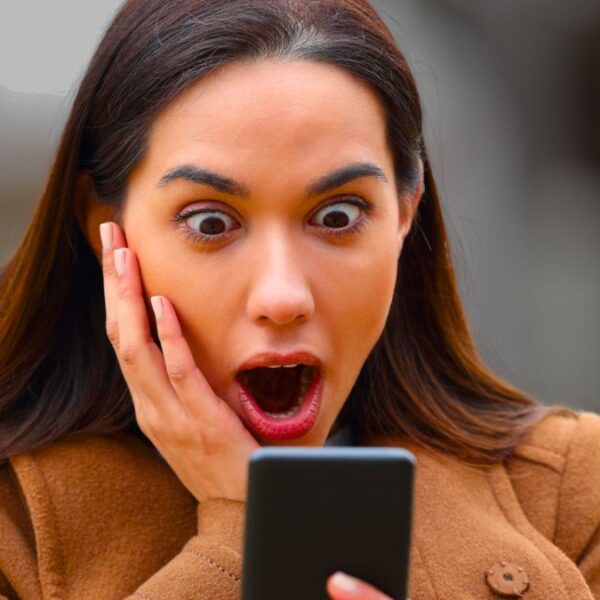 woman shocked phone
