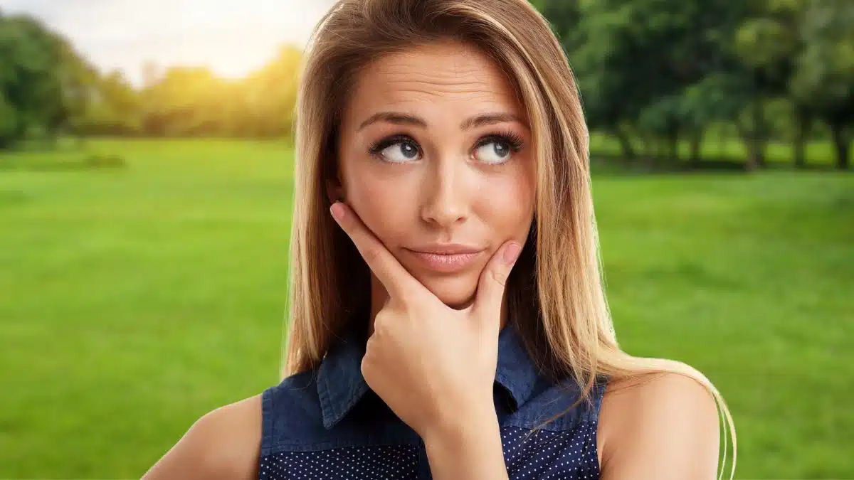 woman wondering thinking at a park