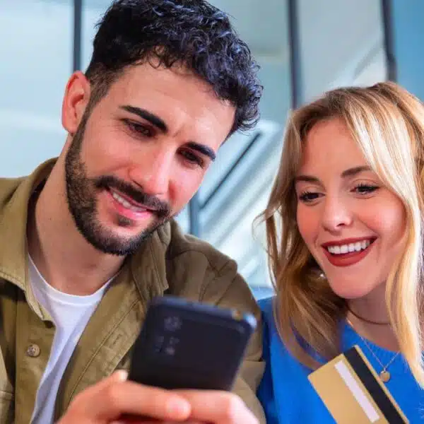 couple phone credit card happy