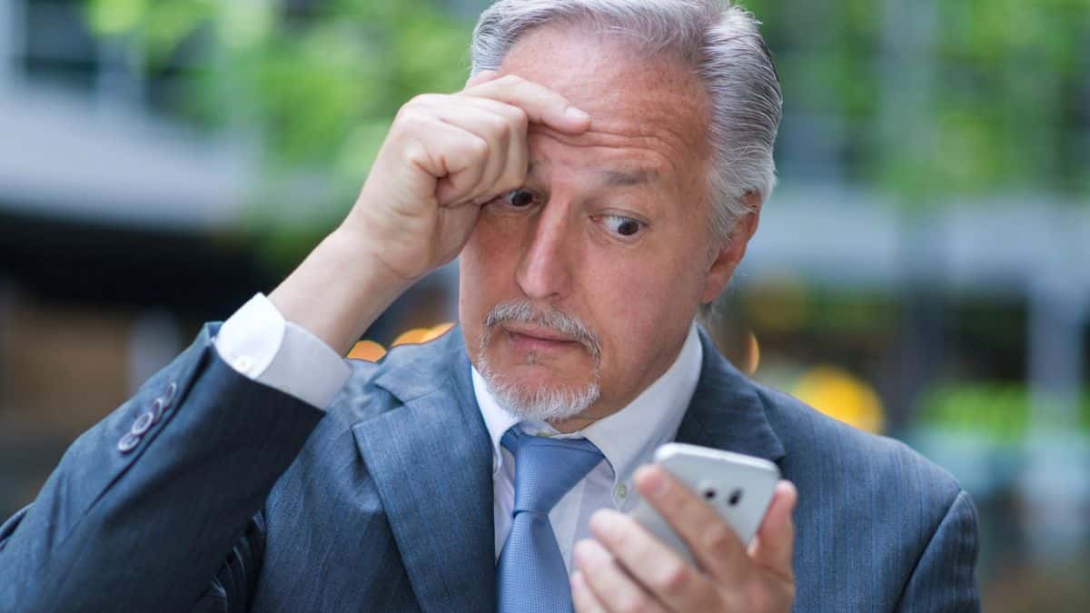 15 Mistakes That Wreck People's Retirement man beard worried phone