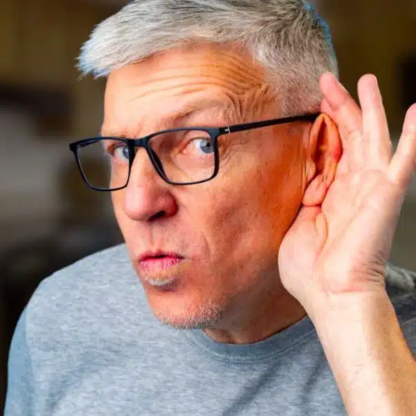 mature man glasses listening