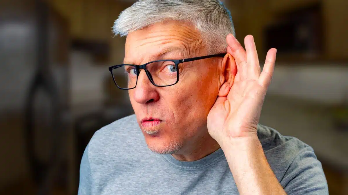 mature man glasses listening