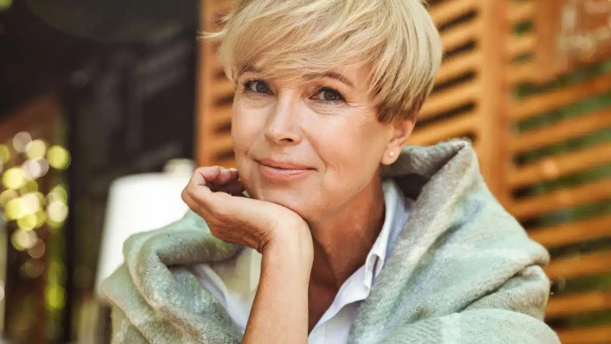 mature woman sitting outside with coffee