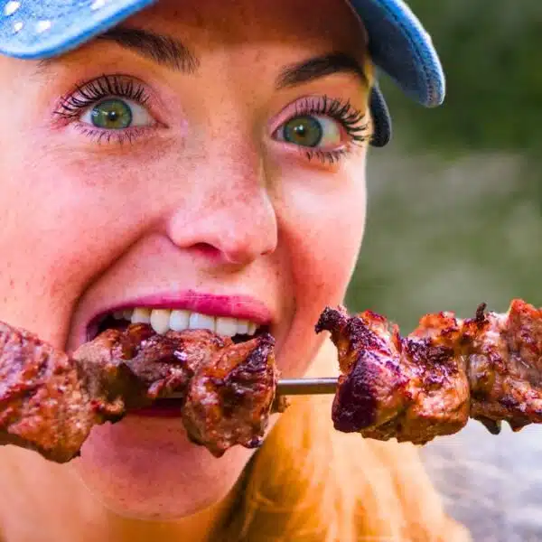woman eating barbeque