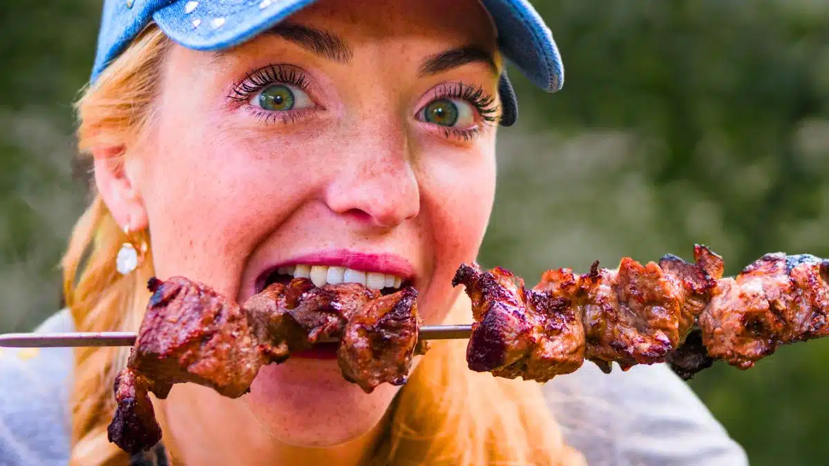 woman eating barbeque
