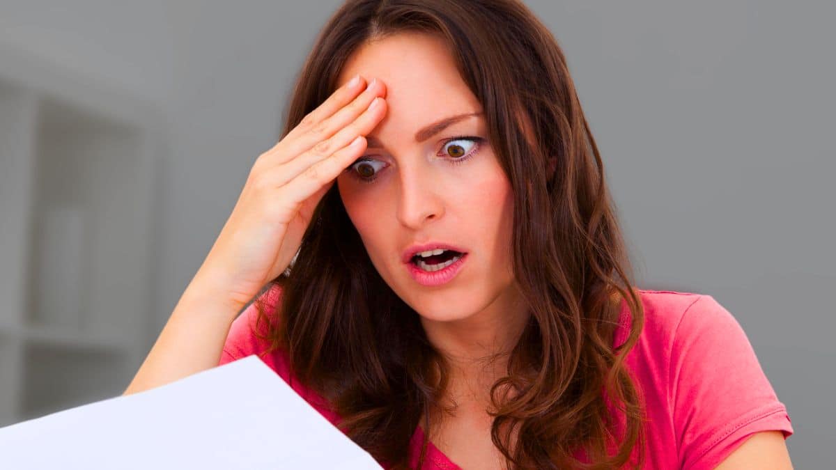 Quiet Budget Leaks That Can Add Up woman shocked at document