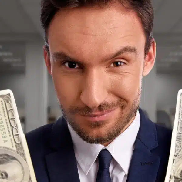 business man holding cash in office