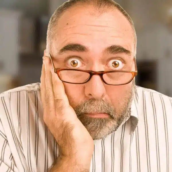 man senior glasses kitchen nervous