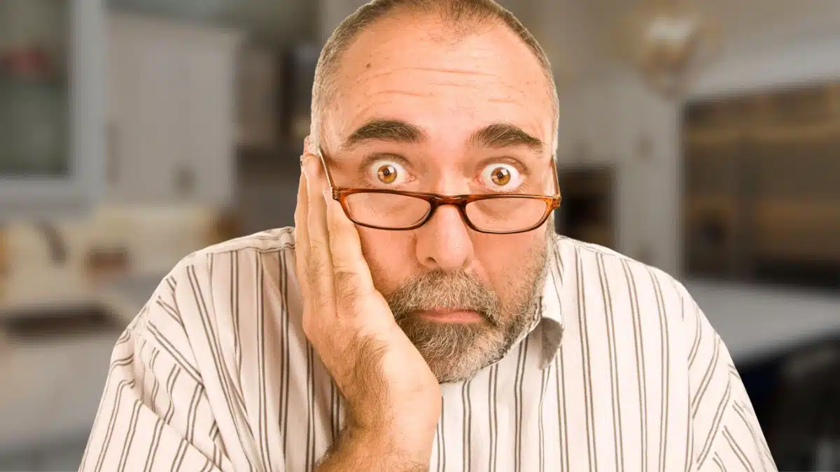 man senior glasses kitchen nervous