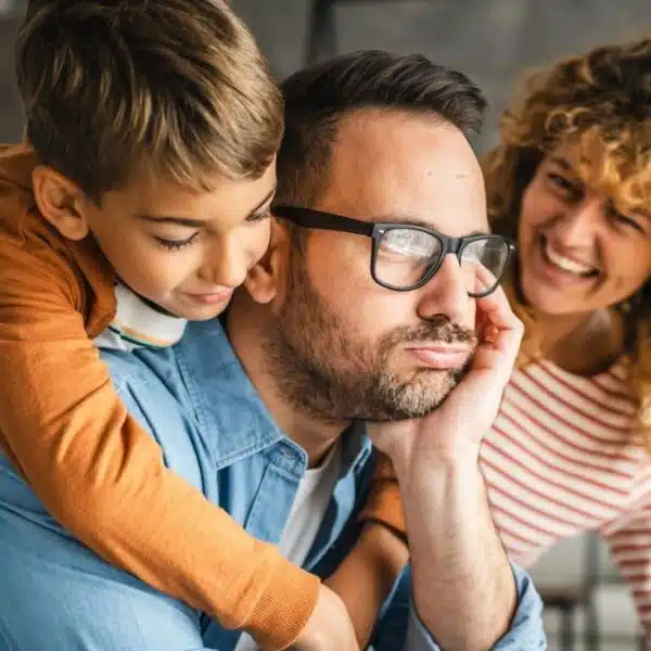 man working with family