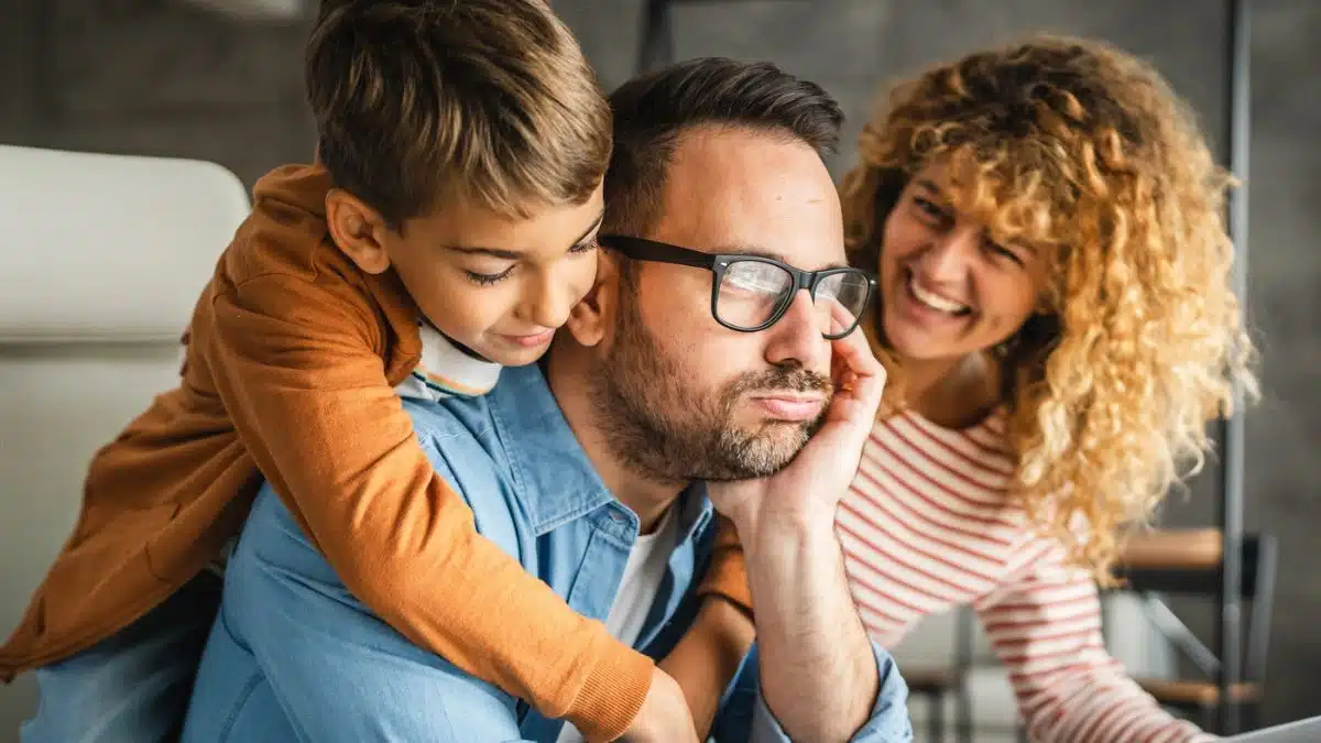 man working with family