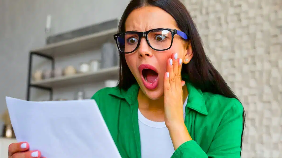 woman glasses bills expenses laptop