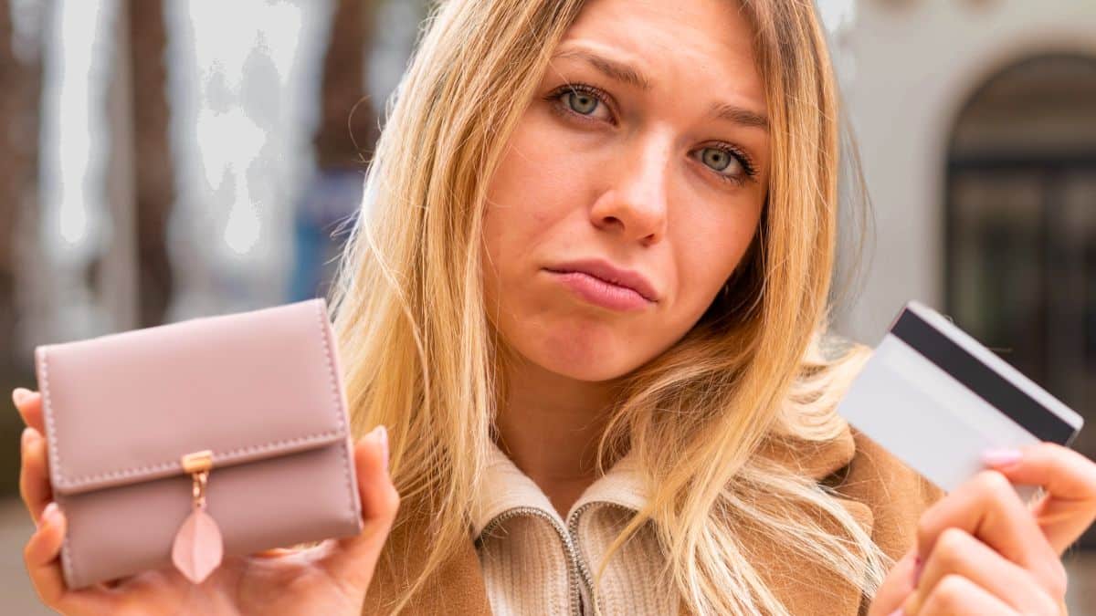 woman wallet credit card sad