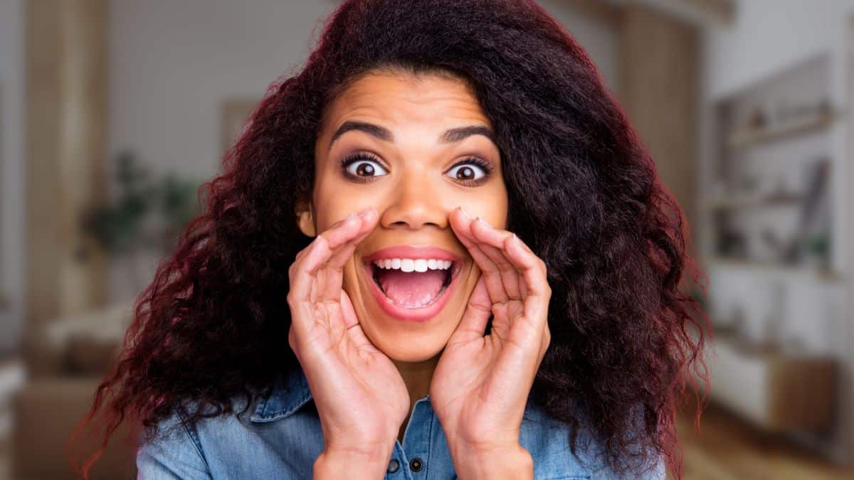 happy woman shouting at home