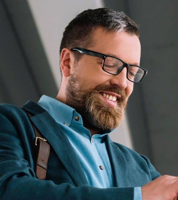 man beard coat smiling