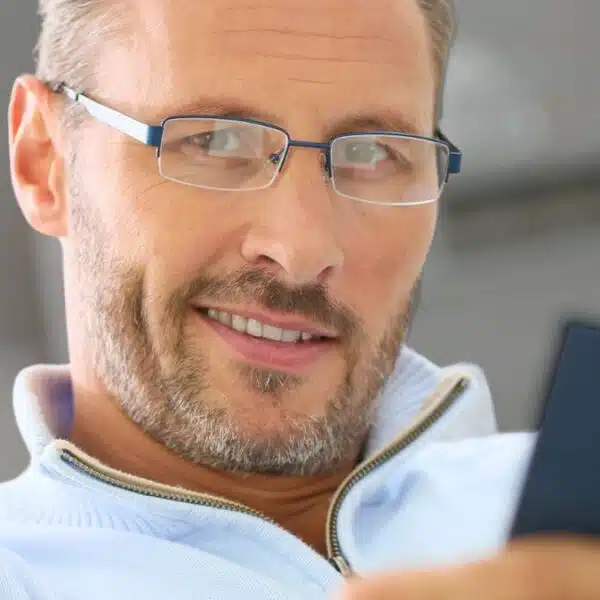 man glasses reading a book