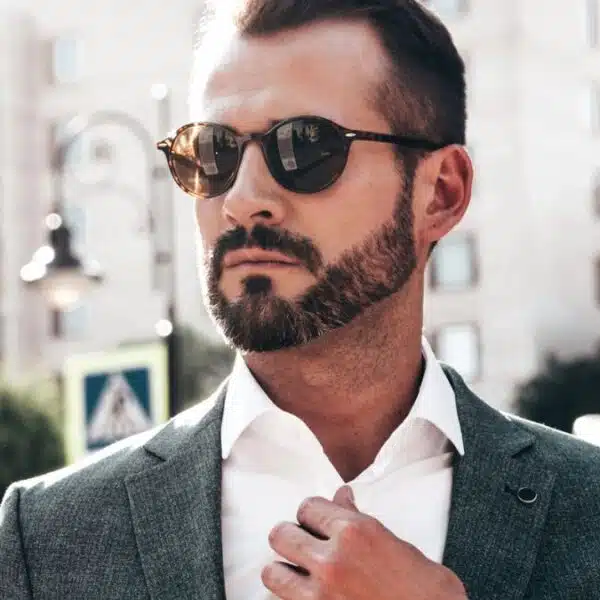 man sunglasses suit beard