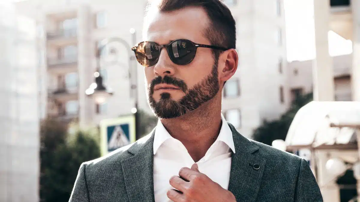 man sunglasses suit beard