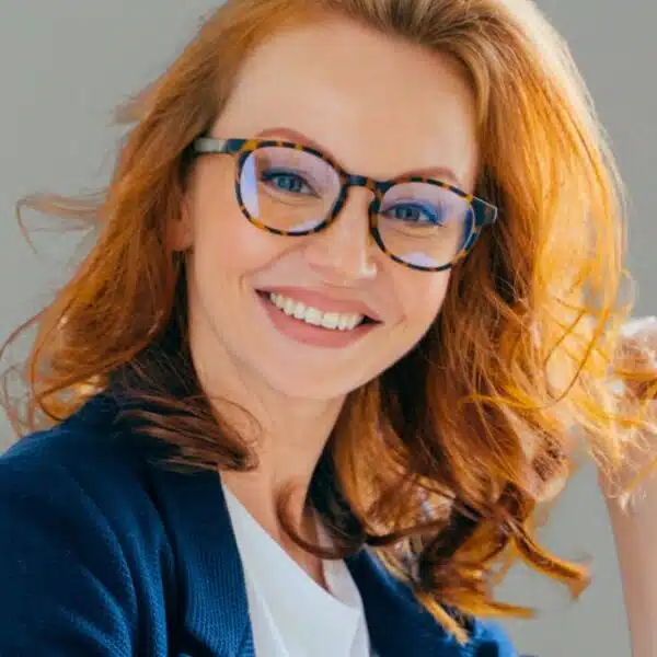 woman glasses redhead desk work