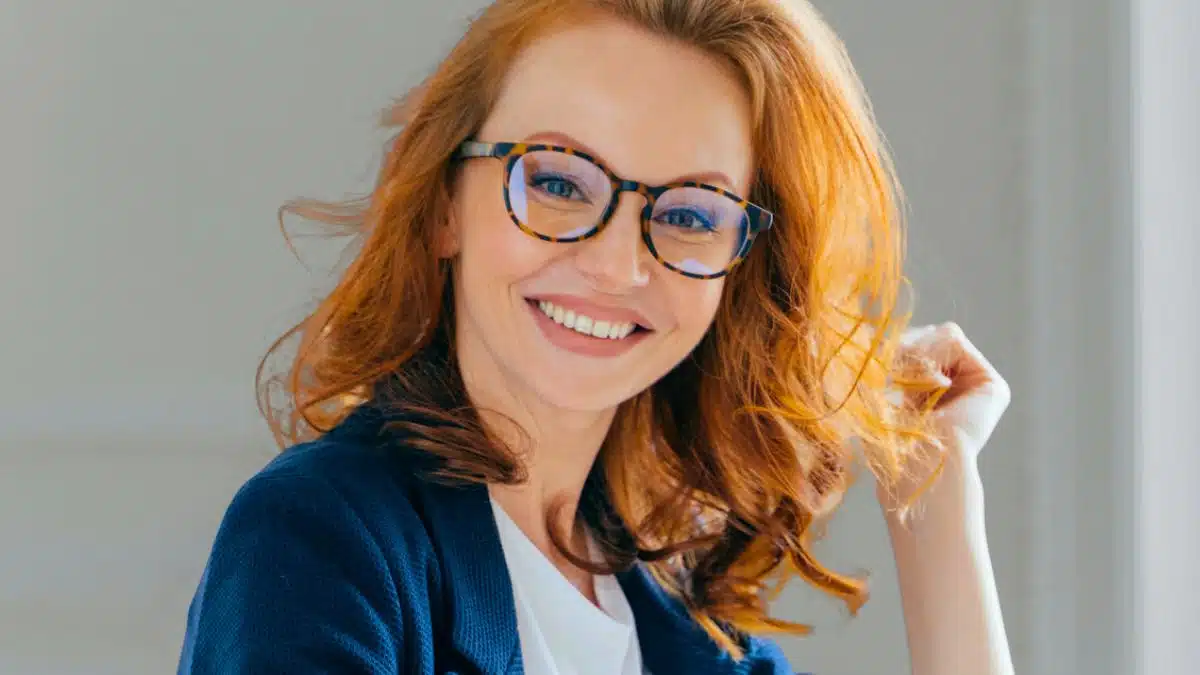 woman glasses redhead desk work