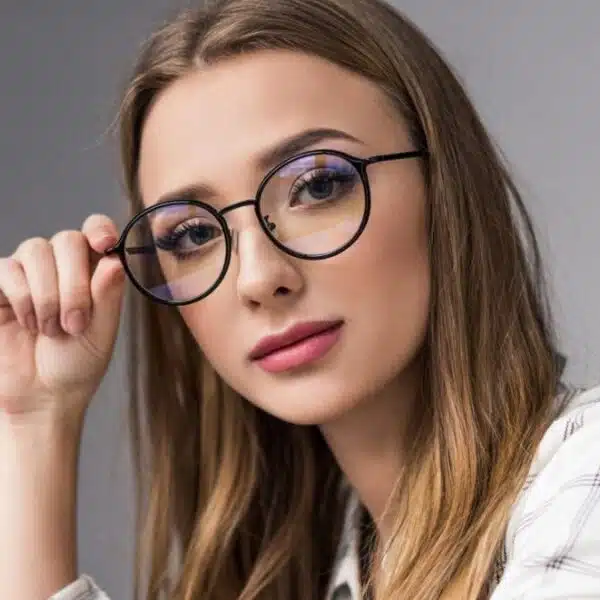 woman glasses sitting at a desk