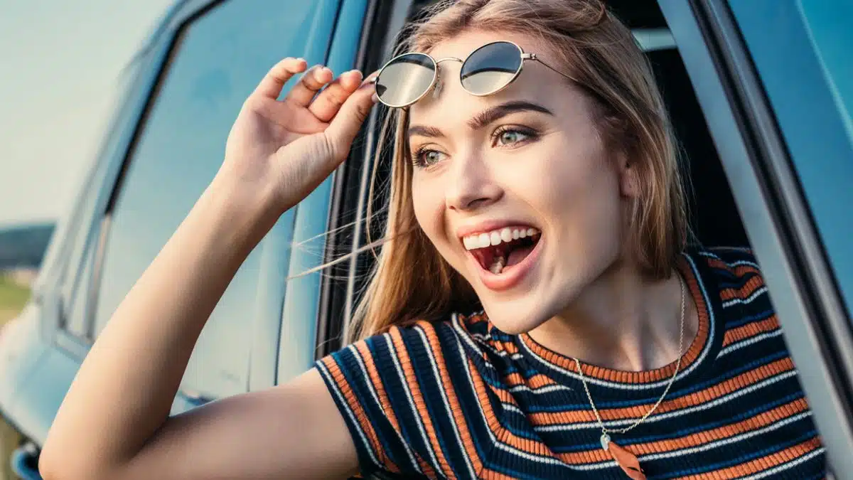 woman pasenger car sunglasses