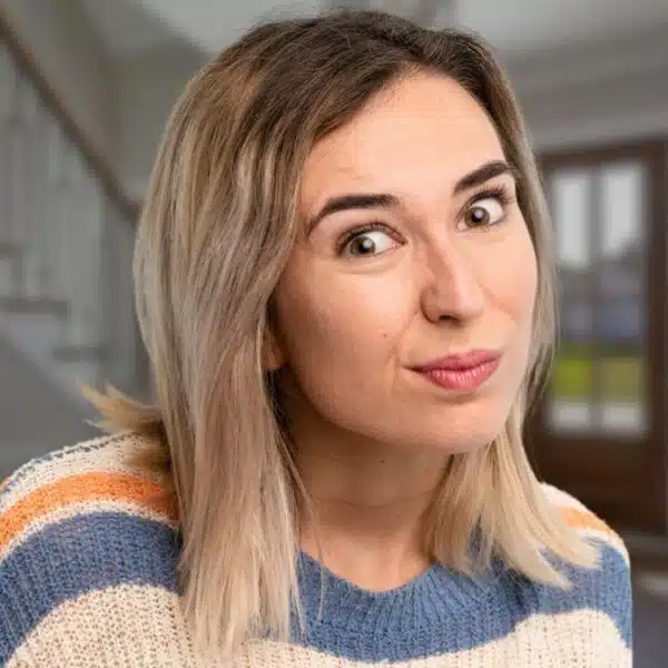 woman shy wearing a sweater colorful