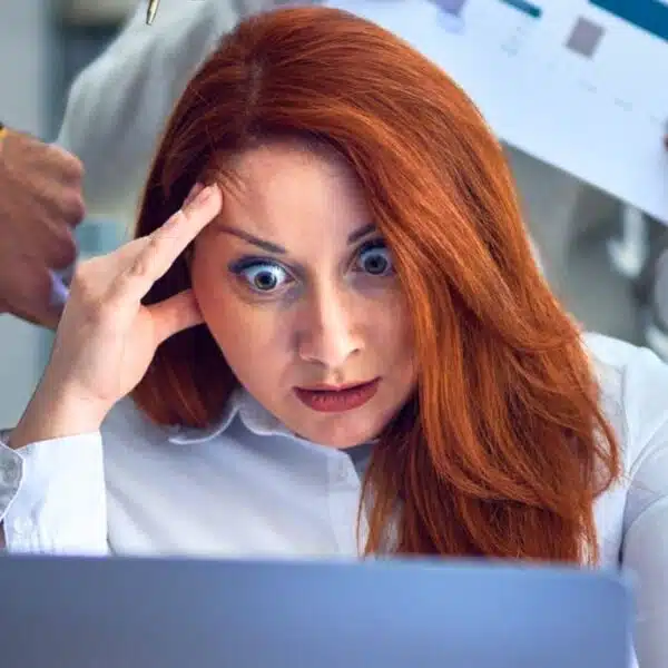 woman working hard at a desk busy