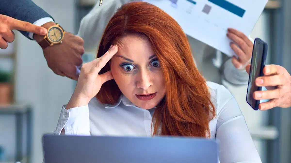 woman working hard at a desk busy