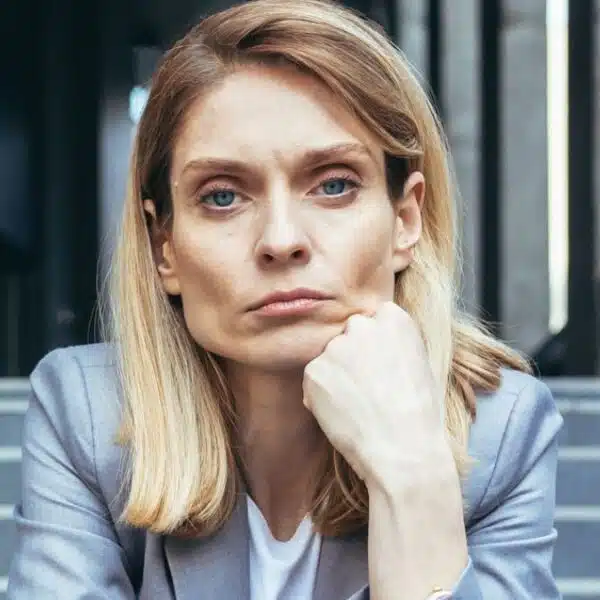 business woman sitting on steps sad
