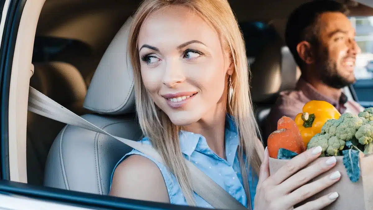 couple groceries riding in car