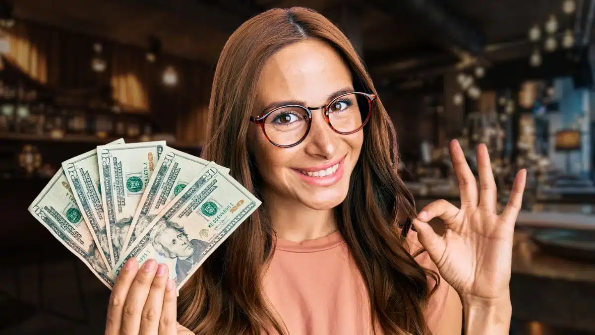 woman glasses holding cash happy smile