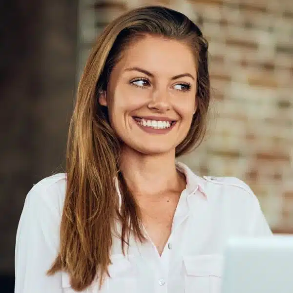 woman happy on a laptop