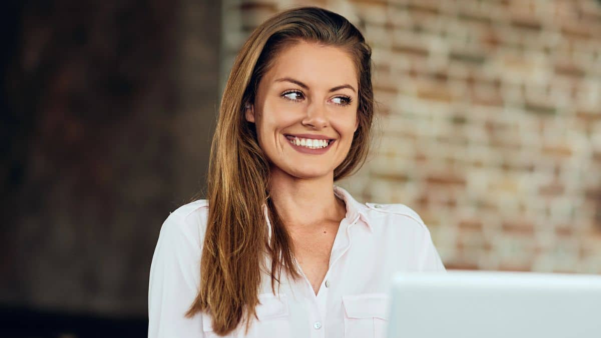 woman happy on a laptop