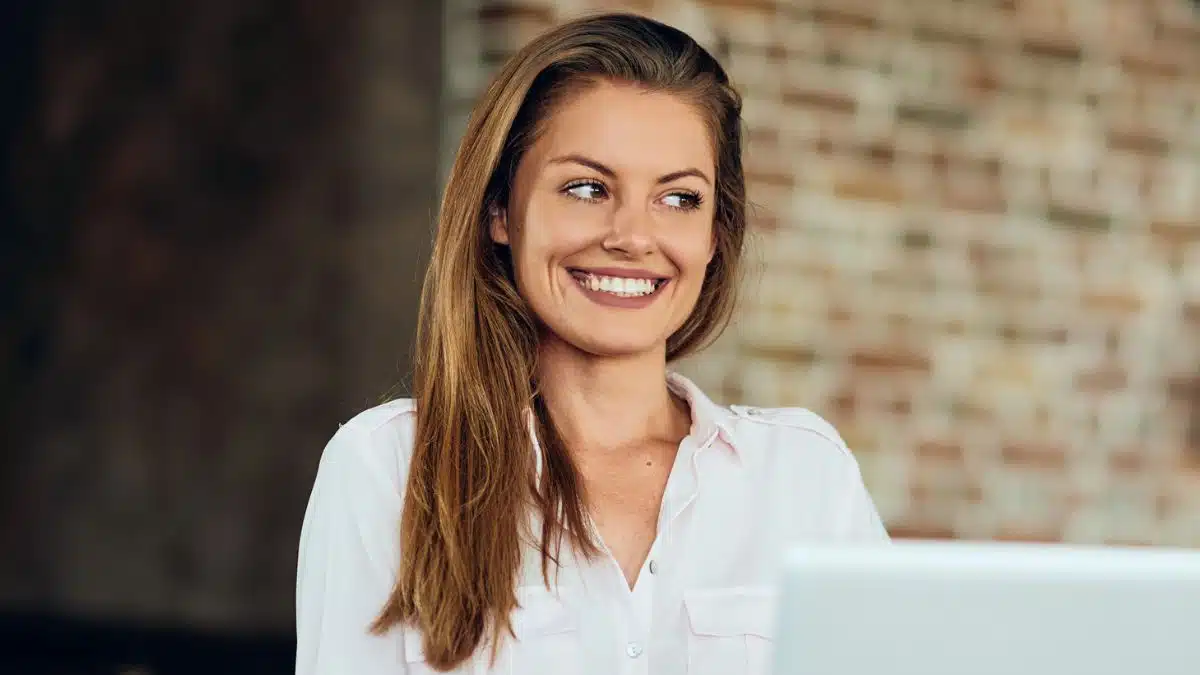 woman happy on a laptop