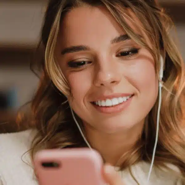 woman headphones laptop working