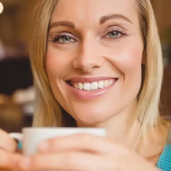woman holding coffee cup