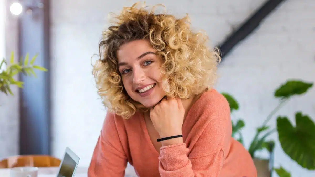 woman laptop glasses overalls