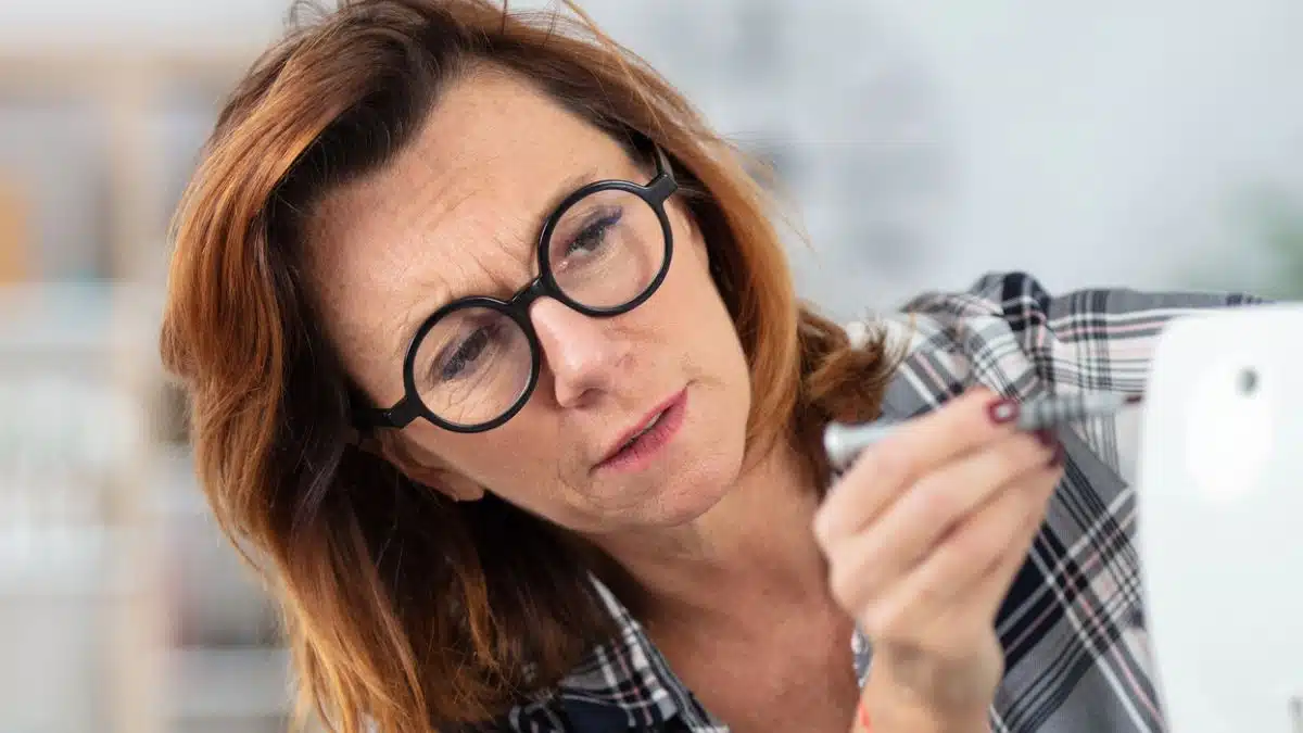 woman sewing glasses repair