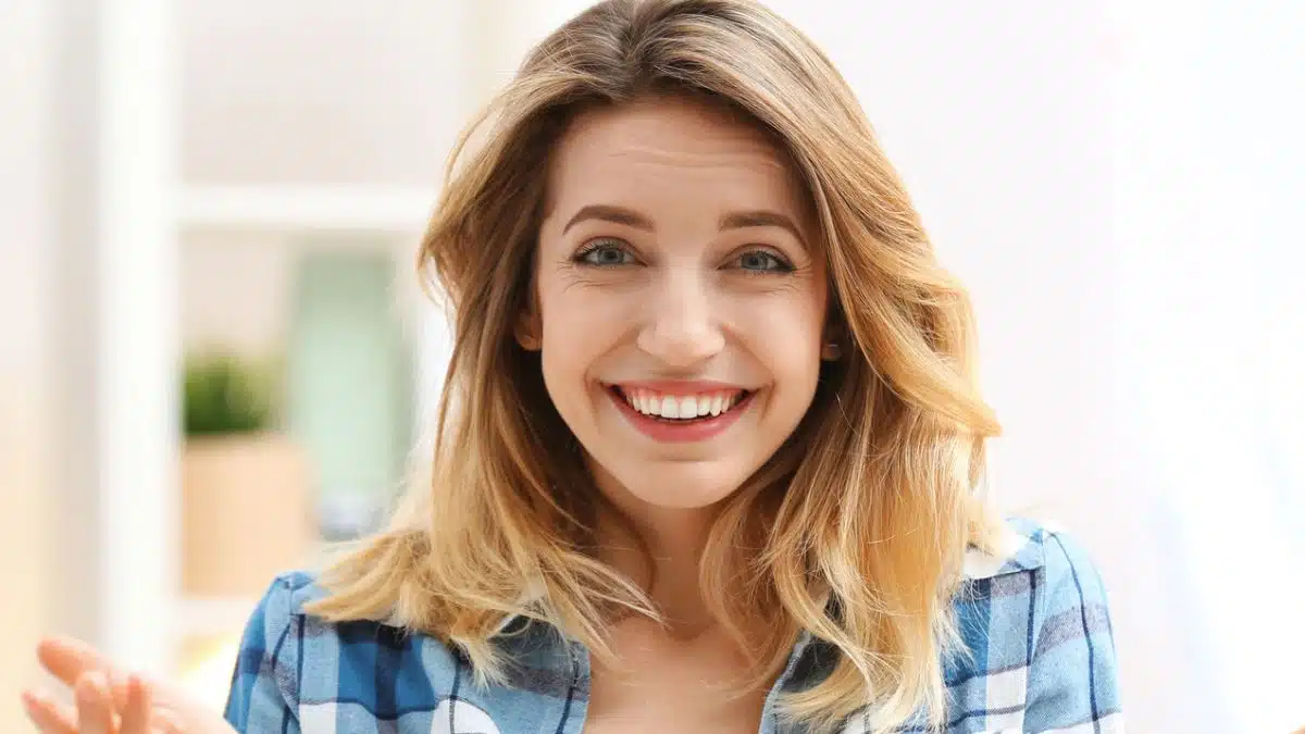 woman smiling happy plaid shirt