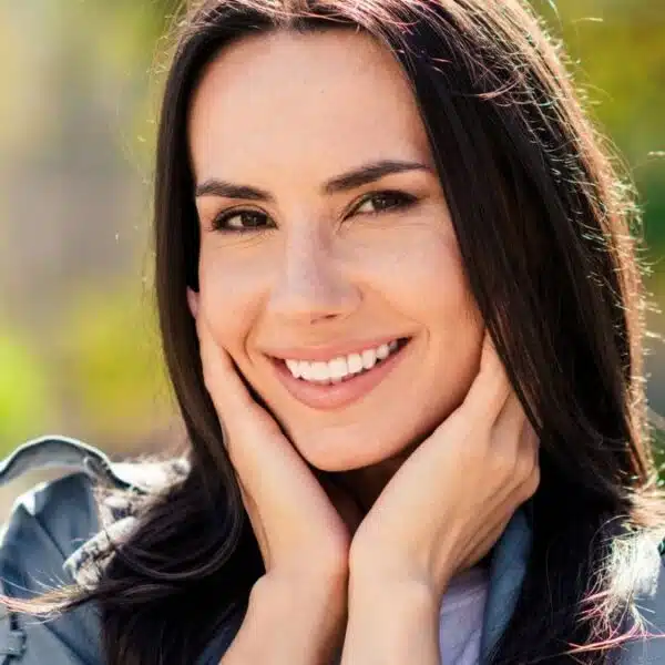 woman smiling outside garden