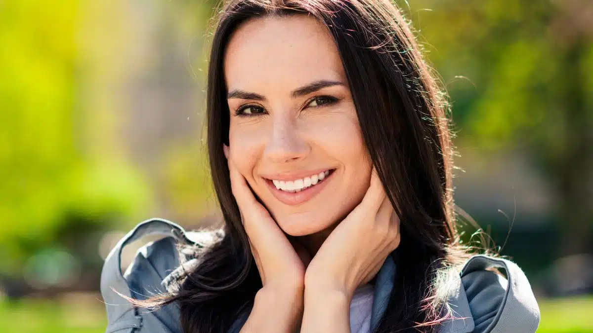 woman smiling outside garden