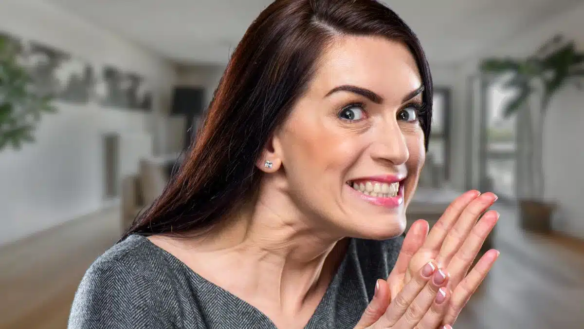 woman sneaky happy at home