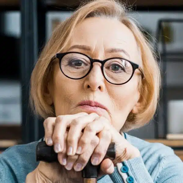 woman stressed glasses sitting elder