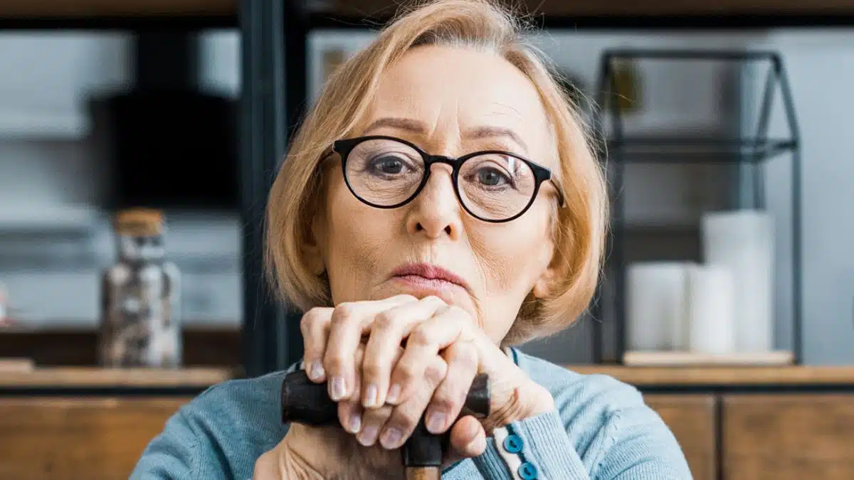 woman stressed glasses sitting elder