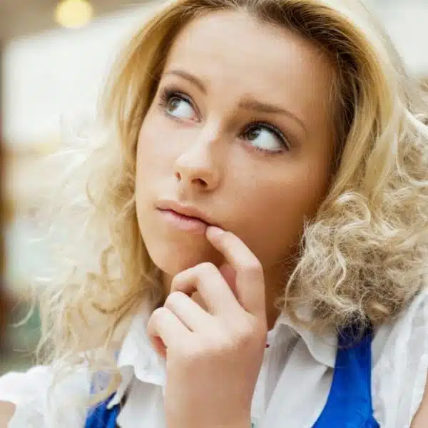 woman thinking blonde alone